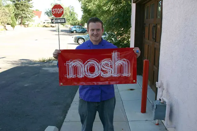Nosh banner held by a customer
