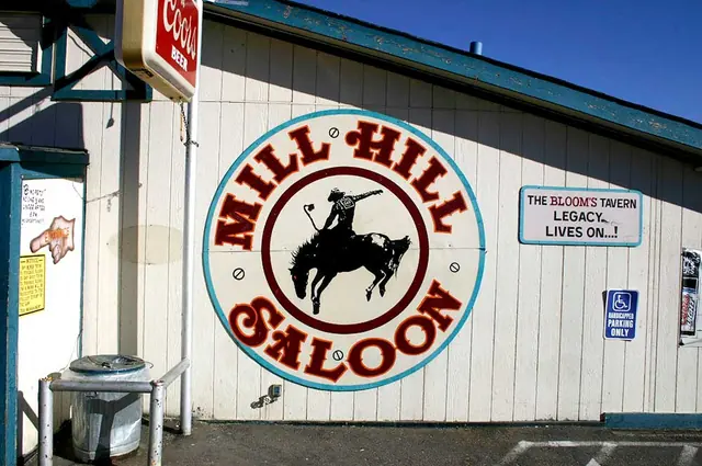 Mill Hill Saloon round building sign