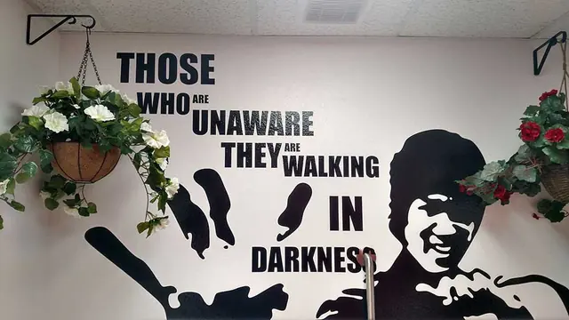 Vinyl wall quote graphic with silhouette artwork