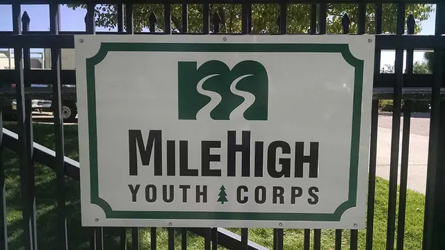 MileHigh Youth Corps fence sign