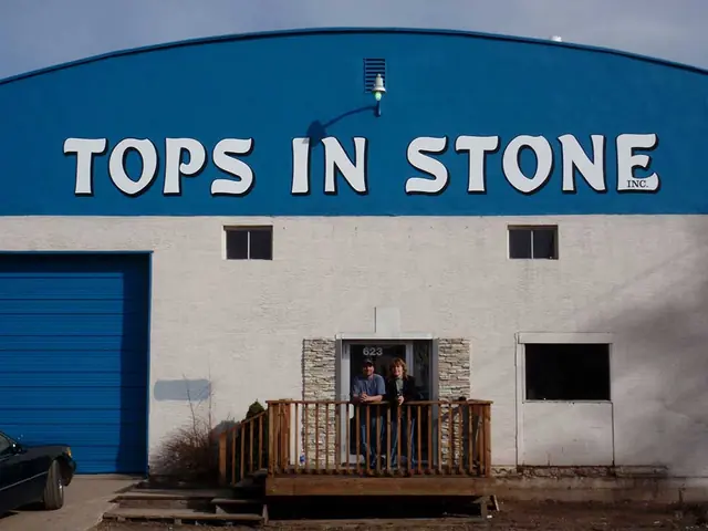 Tops in Stone building sign