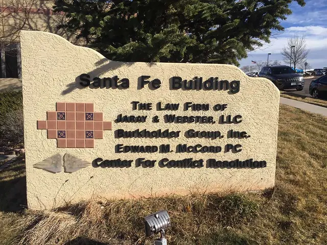 Building name lettering on a stone monument