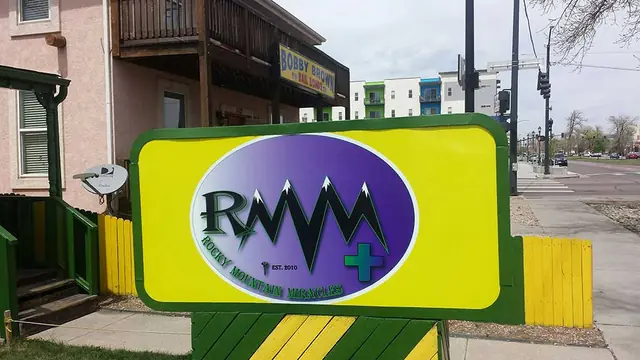 Round logo sign on a post