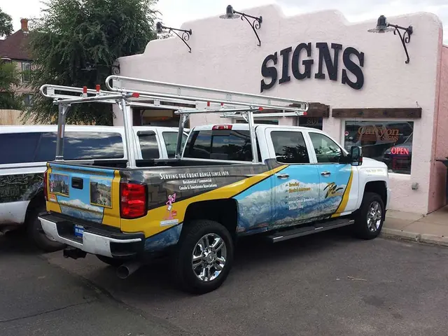 Wrapped pickup truck parked at the sign shop