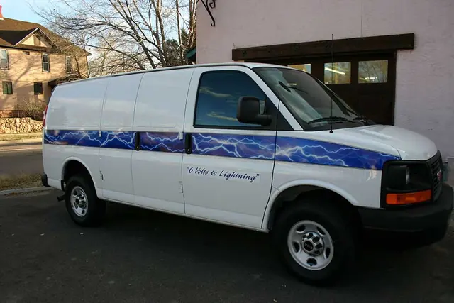 White van with blue swoosh graphics