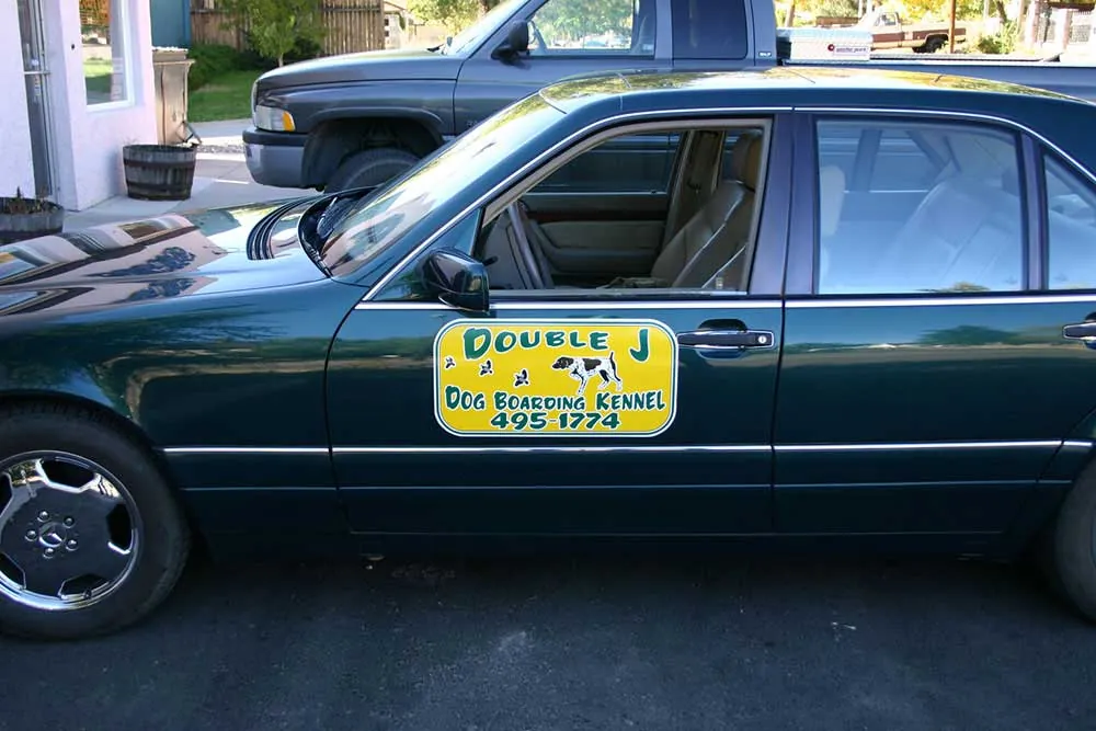 Sedan with magnetic door sign