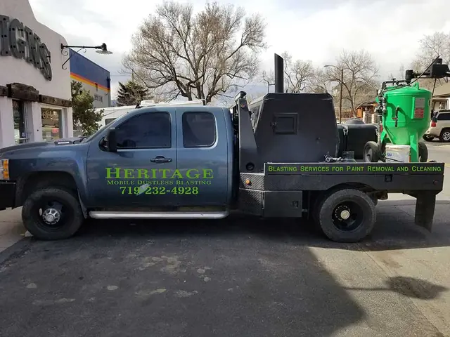 Pickup towing a trailer with graphics