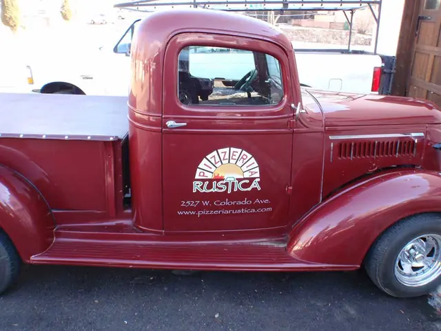 Classic red pickup with door logo
