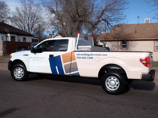 White pickup with logo graphics